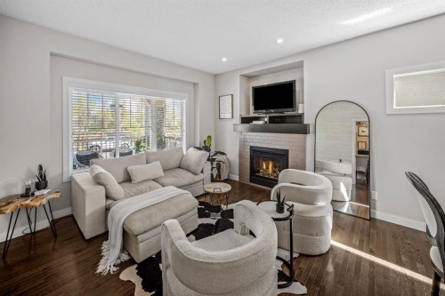 67 Mahogany Row Se, Calgary, AB - Indoor Photo Showing Living Room With Fireplace