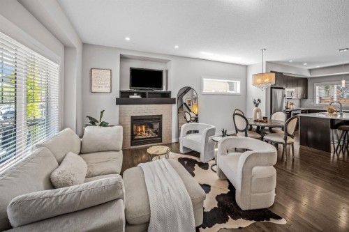 67 Mahogany Row Se, Calgary, AB - Indoor Photo Showing Living Room With Fireplace