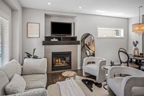 67 Mahogany Row Se, Calgary, AB - Indoor Photo Showing Living Room With Fireplace