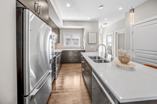 67 Mahogany Row Se, Calgary, AB - Indoor Photo Showing Kitchen With Double Sink With Upgraded Kitchen