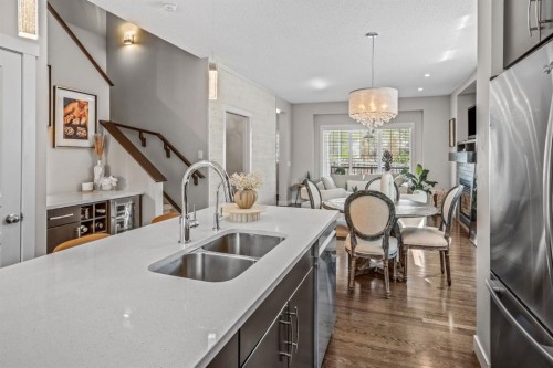 67 Mahogany Row Se, Calgary, AB - Indoor Photo Showing Kitchen With Double Sink With Upgraded Kitchen