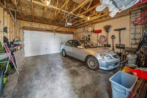 67 Mahogany Row Se, Calgary, AB - Indoor Photo Showing Garage