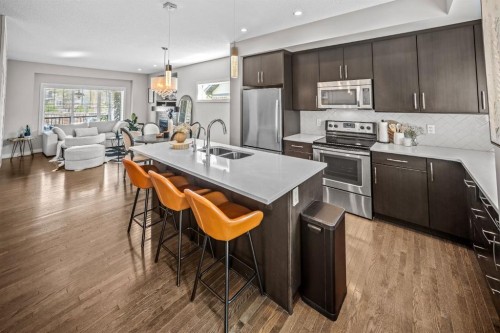 67 Mahogany Row Se, Calgary, AB - Indoor Photo Showing Kitchen With Double Sink With Upgraded Kitchen