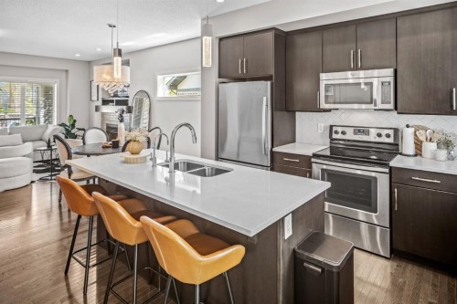 67 Mahogany Row Se, Calgary, AB - Indoor Photo Showing Kitchen With Double Sink With Upgraded Kitchen