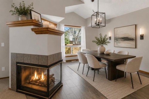 24 Citadel Close Nw, Calgary, AB - Indoor Photo Showing Dining Room With Fireplace