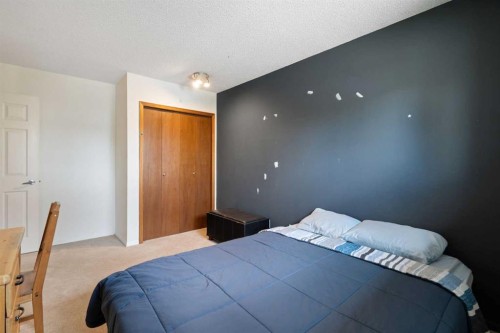 8 Hawkwood Place Nw, Calgary, AB - Indoor Photo Showing Bedroom