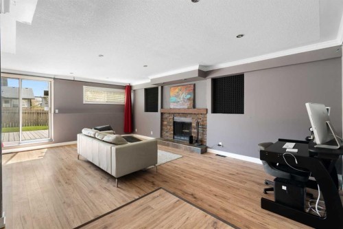 8 Hawkwood Place Nw, Calgary, AB - Indoor With Fireplace