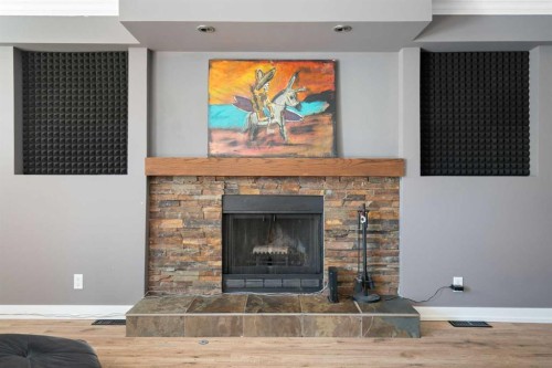 8 Hawkwood Place Nw, Calgary, AB - Indoor Photo Showing Living Room With Fireplace
