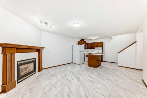 12634 Coventry Hills Way Ne, Calgary, AB - Indoor Photo Showing Other Room With Fireplace