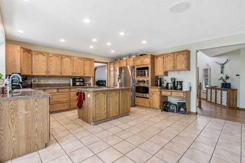 35 Candle Court Sw, Calgary, AB - Indoor Photo Showing Kitchen With Double Sink