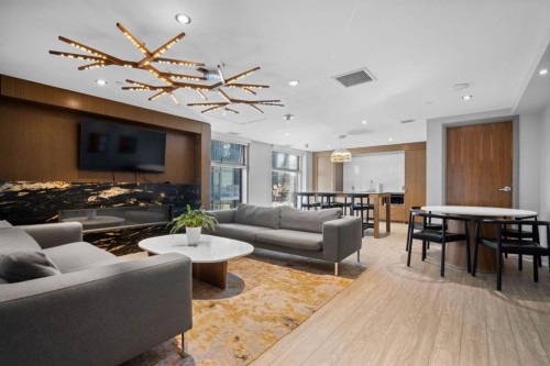 501-138 Waterfront Court Sw, Calgary, AB - Indoor Photo Showing Living Room