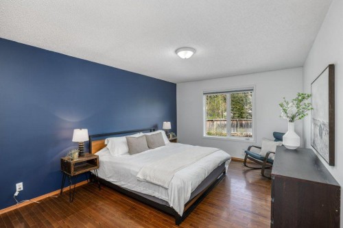 128 Sunterra Heights, Cochrane, AB - Indoor Photo Showing Bedroom