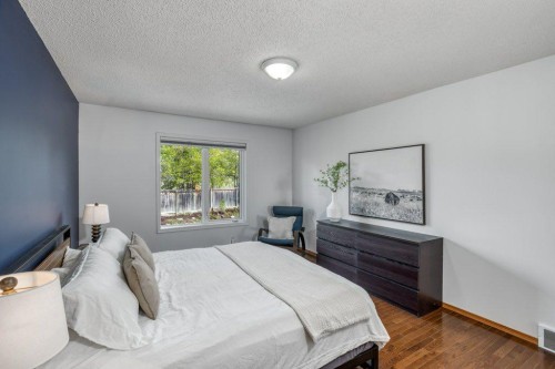 128 Sunterra Heights, Cochrane, AB - Indoor Photo Showing Bedroom