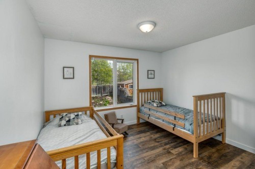 128 Sunterra Heights, Cochrane, AB - Indoor Photo Showing Bedroom