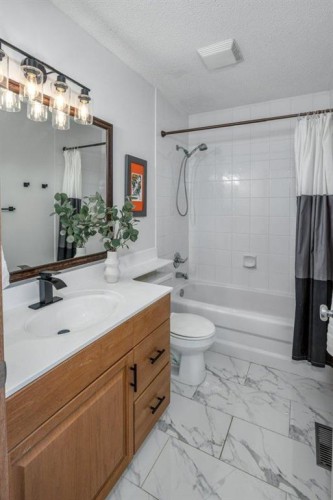 128 Sunterra Heights, Cochrane, AB - Indoor Photo Showing Bathroom