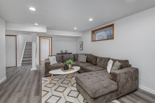 128 Sunterra Heights, Cochrane, AB - Indoor Photo Showing Living Room