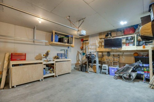 128 Sunterra Heights, Cochrane, AB - Indoor Photo Showing Garage