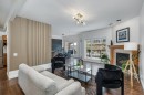 128 Sunterra Heights, Cochrane, AB  - Indoor Photo Showing Living Room With Fireplace 