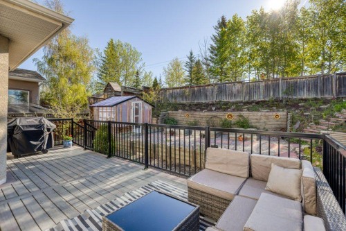 128 Sunterra Heights, Cochrane, AB - Outdoor With Deck Patio Veranda With Exterior