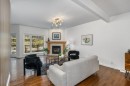 128 Sunterra Heights, Cochrane, AB  - Indoor Photo Showing Living Room With Fireplace 