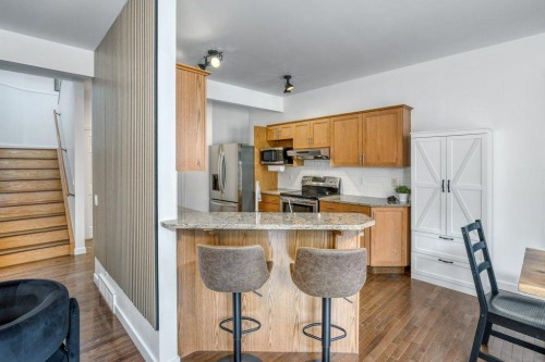 128 Sunterra Heights, Cochrane, AB - Indoor Photo Showing Kitchen