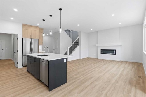 190 Annette Landing Nw, Calgary, AB - Indoor Photo Showing Kitchen With Fireplace With Stainless Steel Kitchen With Upgraded Kitchen
