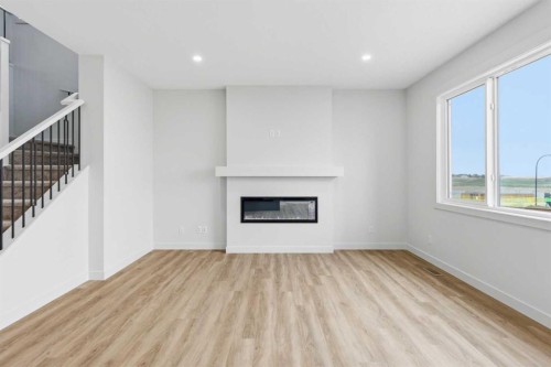 190 Annette Landing Nw, Calgary, AB - Indoor Photo Showing Living Room With Fireplace