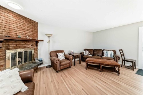 5007 Vallance Crescent Nw, Calgary, AB - Indoor Photo Showing Living Room With Fireplace
