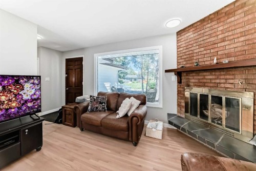 5007 Vallance Crescent Nw, Calgary, AB - Indoor Photo Showing Living Room With Fireplace
