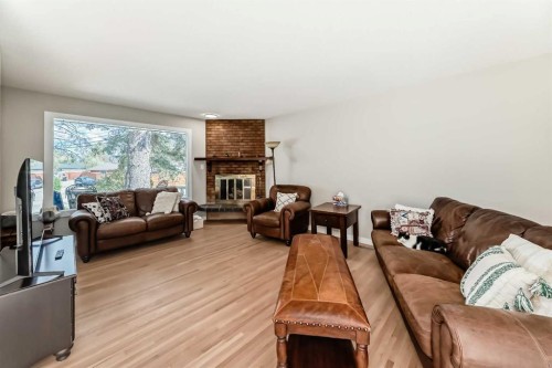 5007 Vallance Crescent Nw, Calgary, AB - Indoor Photo Showing Living Room With Fireplace