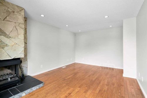 124 Bergen Crescent Nw, Calgary, AB - Indoor Photo Showing Other Room With Fireplace
