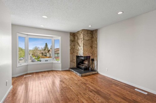 124 Bergen Crescent Nw, Calgary, AB - Indoor Photo Showing Living Room With Fireplace