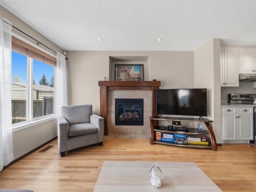 28 Cranberry Lane Se, Calgary, AB - Indoor Photo Showing Living Room With Fireplace