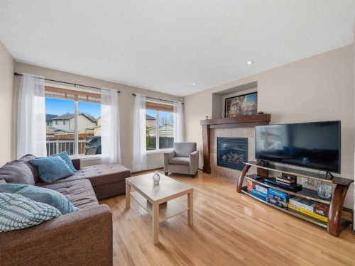 28 Cranberry Lane Se, Calgary, AB - Indoor Photo Showing Living Room With Fireplace
