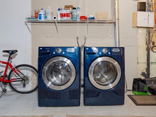 28 Cranberry Lane Se, Calgary, AB - Indoor Photo Showing Laundry Room