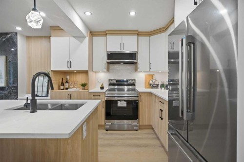 9532 Allison Drive Se, Calgary, AB - Indoor Photo Showing Kitchen With Stainless Steel Kitchen With Double Sink With Upgraded Kitchen