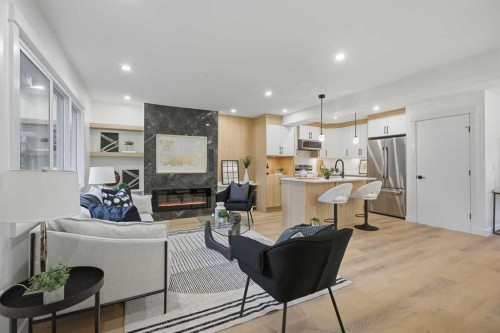 9532 Allison Drive Se, Calgary, AB - Indoor Photo Showing Living Room With Fireplace