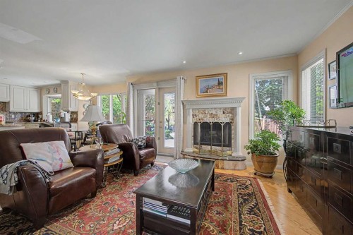 2020 Sirocco Drive Sw, Calgary, AB - Indoor Photo Showing Living Room With Fireplace