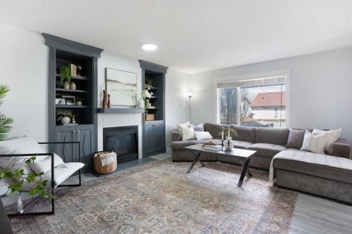 8 Thorndale Close Se, Airdrie, AB - Indoor Photo Showing Living Room With Fireplace