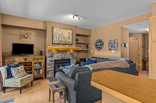 1003-70 Dyrgas Gate, Canmore, AB - Indoor Photo Showing Living Room With Fireplace