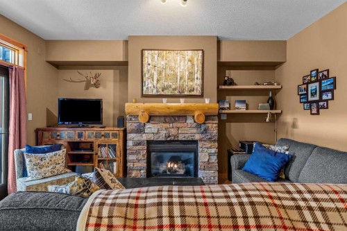 1003-70 Dyrgas Gate, Canmore, AB - Indoor Photo Showing Other Room With Fireplace