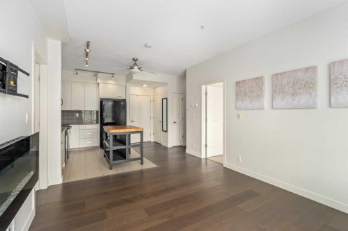 3210-175 Silverado Boulevard Sw, Calgary, AB - Indoor With Fireplace