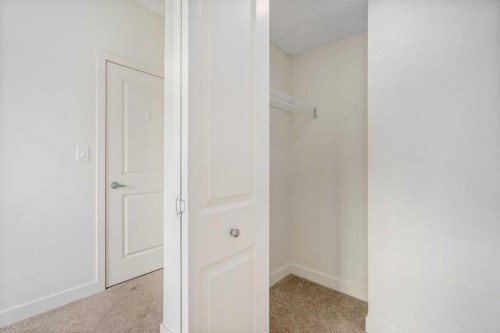 3210-175 Silverado Boulevard Sw, Calgary, AB - Indoor Photo Showing Other Room
