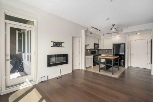 3210-175 Silverado Boulevard Sw, Calgary, AB - Indoor With Fireplace