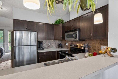6-108 Rockyledge View Nw, Calgary, AB - Indoor Photo Showing Kitchen With Stainless Steel Kitchen With Double Sink