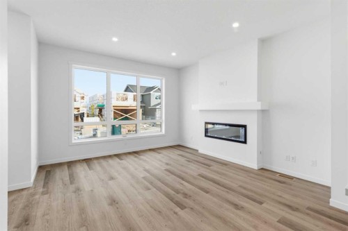 199 Annette Landing Nw, Calgary, AB - Indoor Photo Showing Living Room With Fireplace