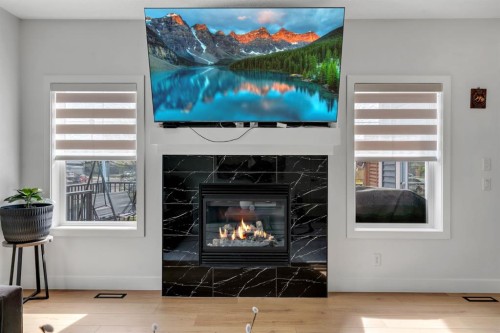 71 Canals Close Sw, Airdrie, AB - Indoor Photo Showing Living Room With Fireplace