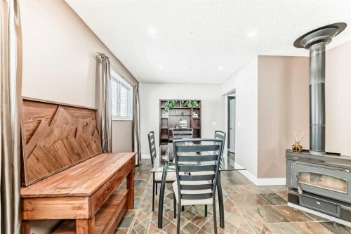 11 Huntstrom Place Ne, Calgary, AB - Indoor Photo Showing Other Room With Fireplace