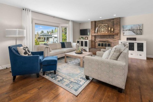 14519 Parkside Drive Se, Calgary, AB - Indoor Photo Showing Living Room With Fireplace