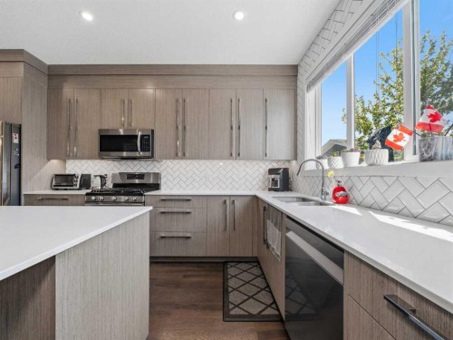 153 Chelsea Drive, Chestermere, AB - Indoor Photo Showing Kitchen With Stainless Steel Kitchen With Double Sink With Upgraded Kitchen